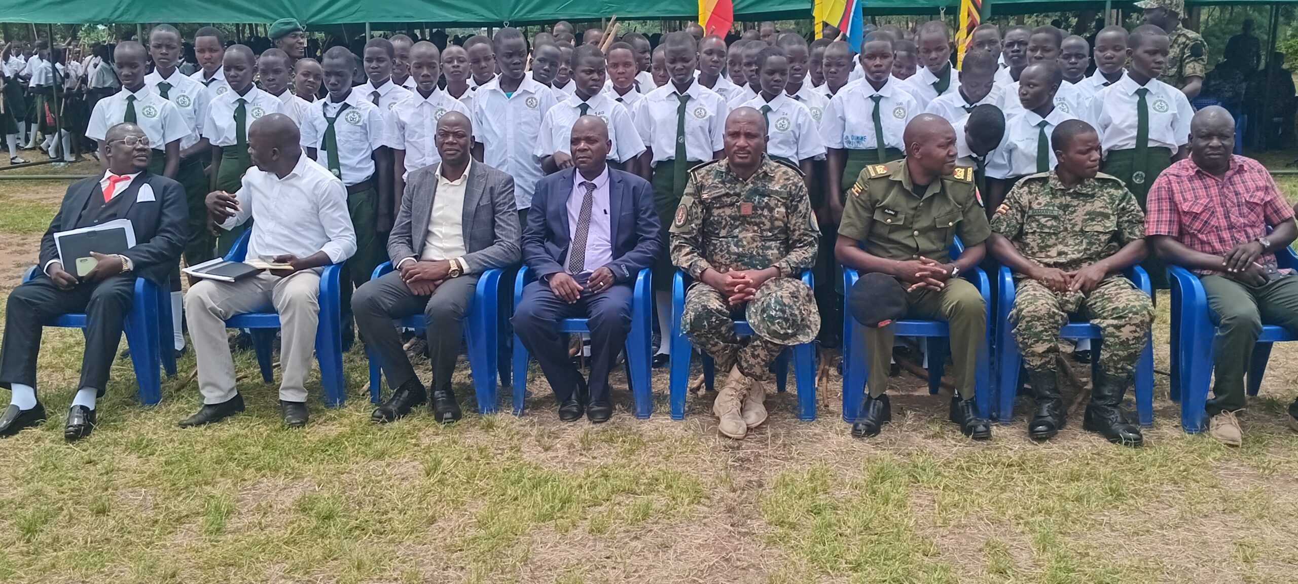 Captain Waiswa Gabriel posing and students during the pass-out ceremony.